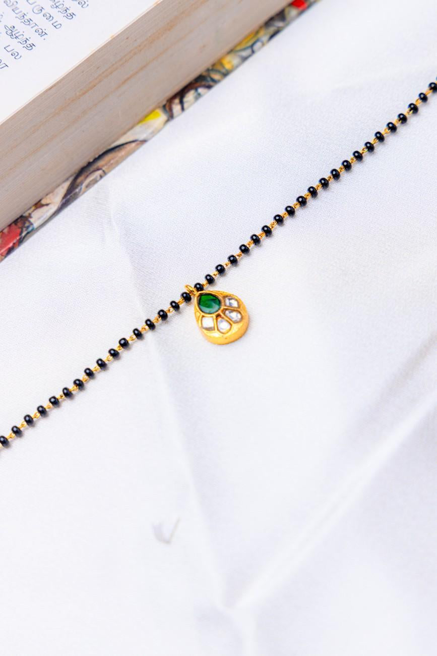 Silver Gold-Plated Mangalsutra Bracelet with Green Stone Pendant