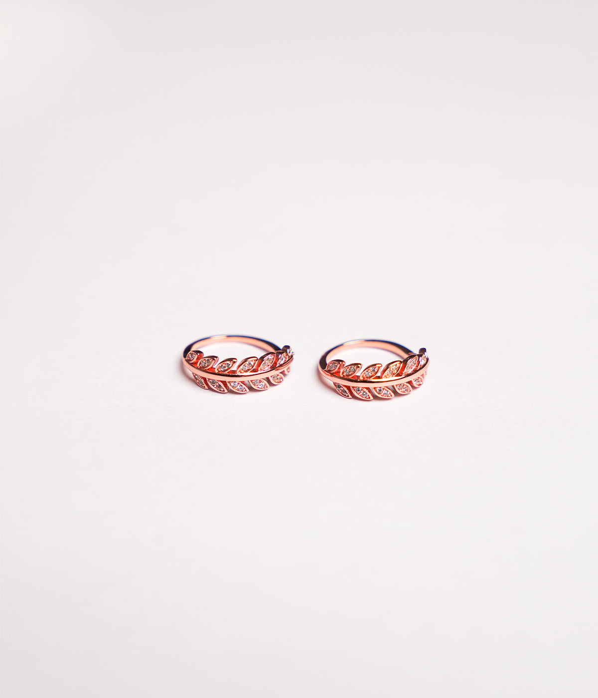 Rose gold plated 92.5 sterling silver toe ring with leaf design and CZ stones.