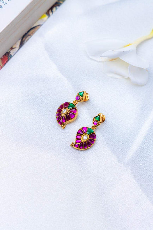 Gold tone mango design earrings with pink and green stone work and a central white stone.