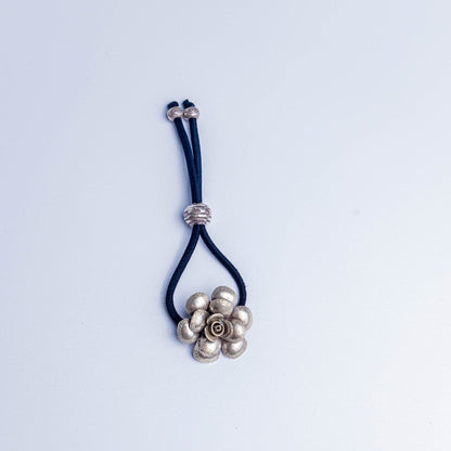 Hair tie with a floral design on a white background