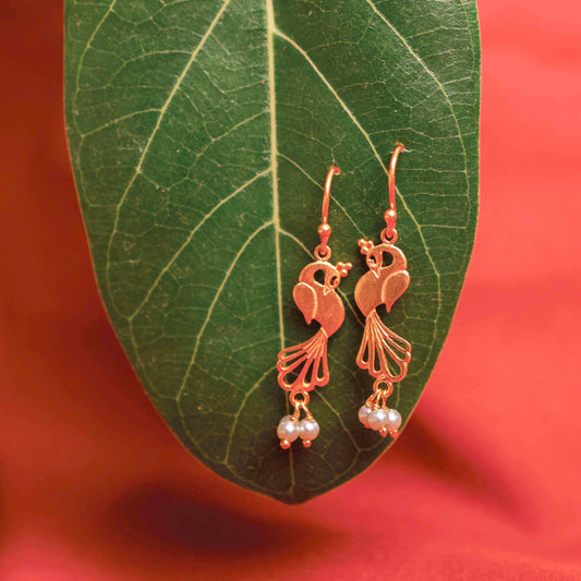 Sterling silver peacock motif earrings with pearl drops inspired by South Indian heritage by Silalankaraa.