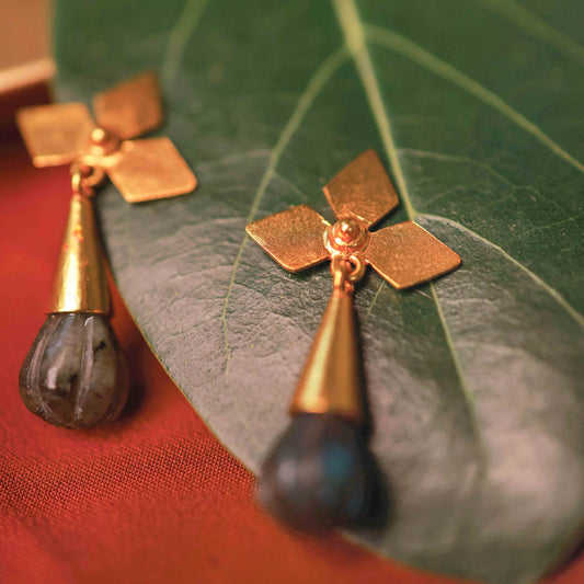 Sterling silver petal design earrings with dark stone drop by Silalankaraa.