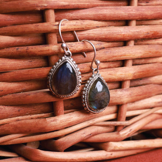 Labradorite teardrop earrings set in polished 92.5 sterling silver.