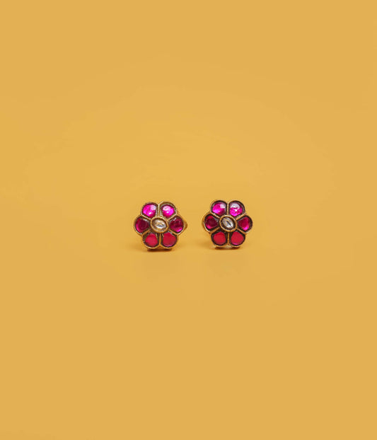 Ruby blossom gold plated stud earrings in 92.5 sterling silver with floral stone design.