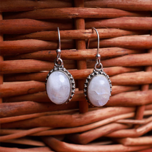 Moonstone oval drop earrings in polished 92.5 sterling silver with minimal contemporary design.