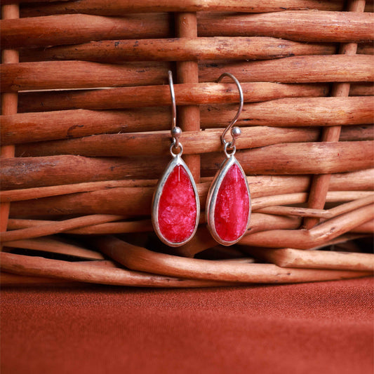 Ruby teardrop earrings in polished 92.5 sterling silver.