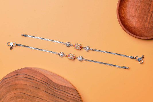 Dual-Toned Floral Charm Silver Anklets.