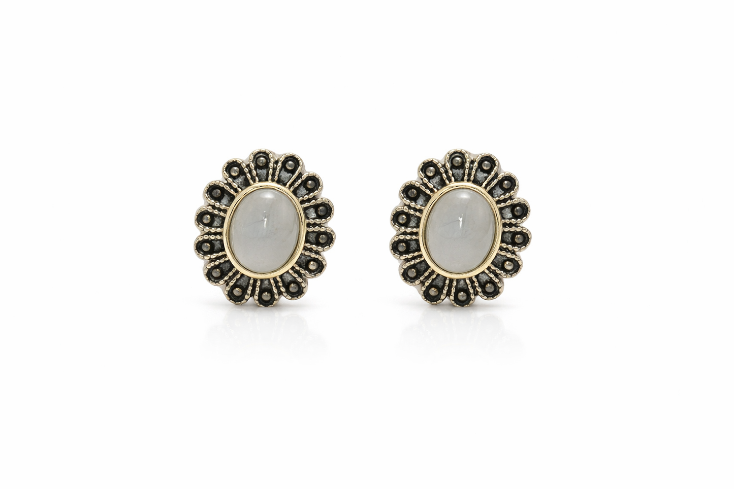 Pair of earrings with gemstones on a white background