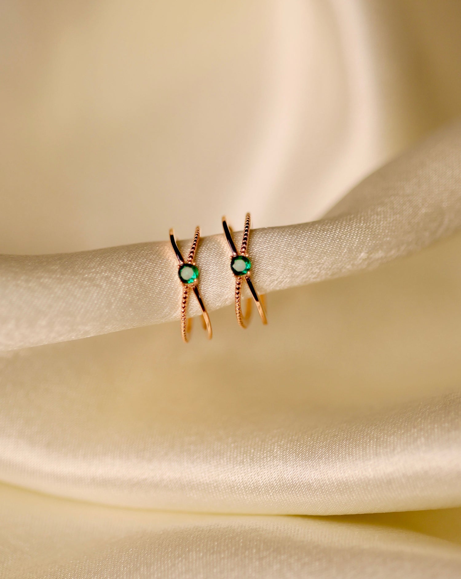 Rose gold X-shaped adjustable toe rings with turquoise gemstone.