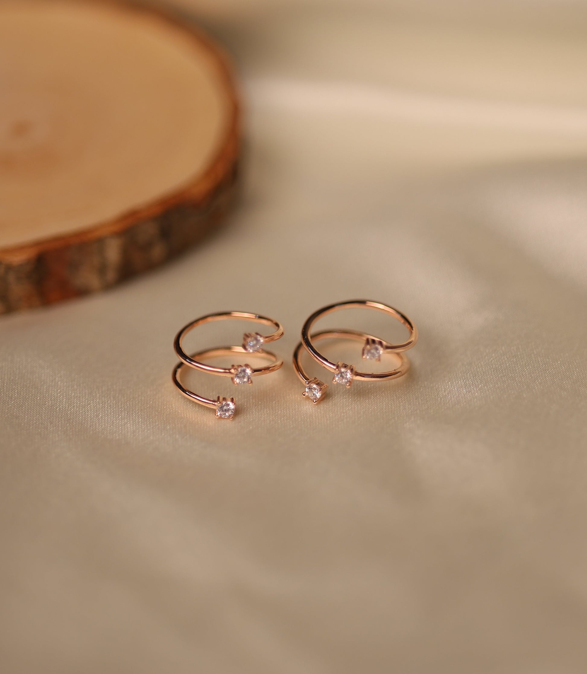 Rose gold triple band adjustable toe rings.