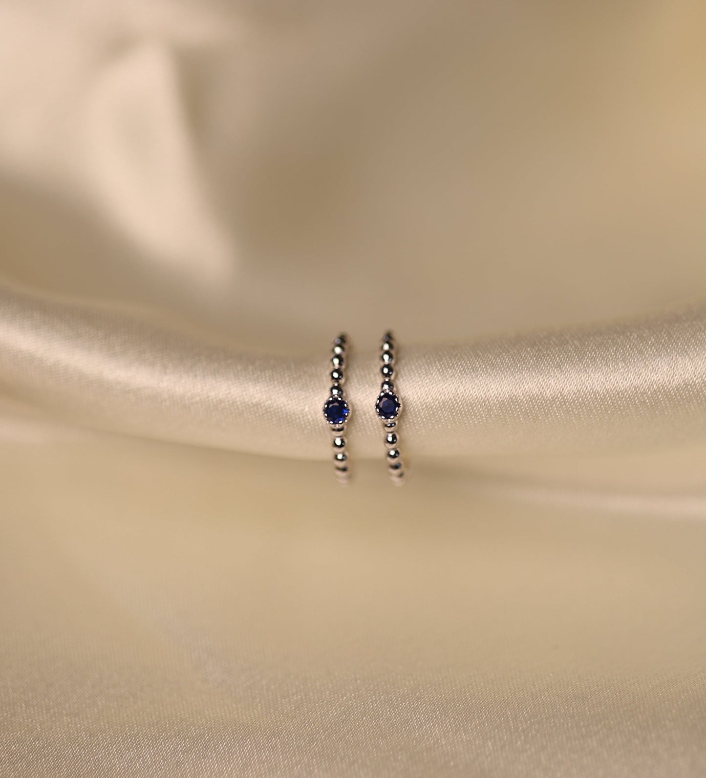 Sterling Silver toe rings with midnight blue beads.