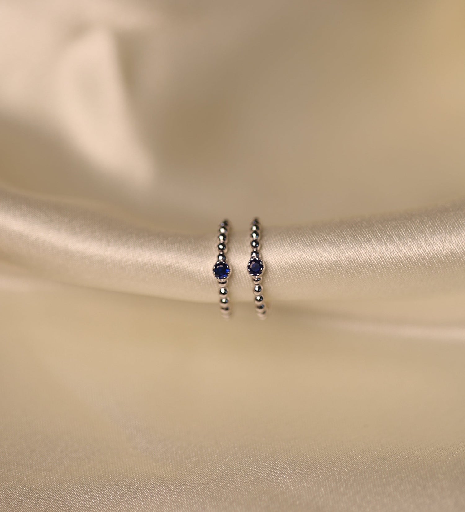 Sterling Silver toe rings with midnight blue beads.