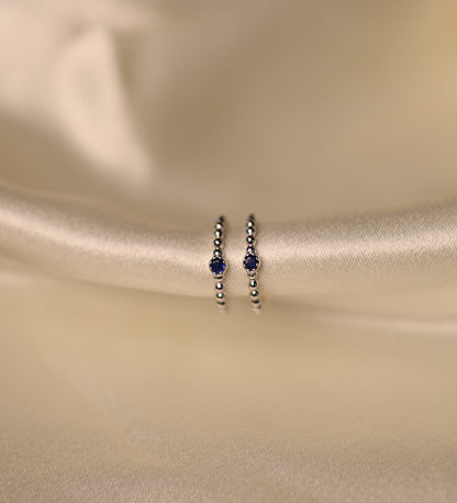 Sterling Silver toe rings with midnight blue beads.