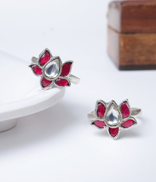92.5 sterling silver lotus toe ring with ruby-red stones and clear centre stone.