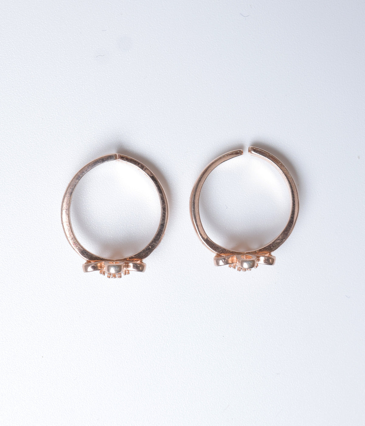 Rose gold floral toe ring in 92.5 sterling silver with sparkling CZ stones.