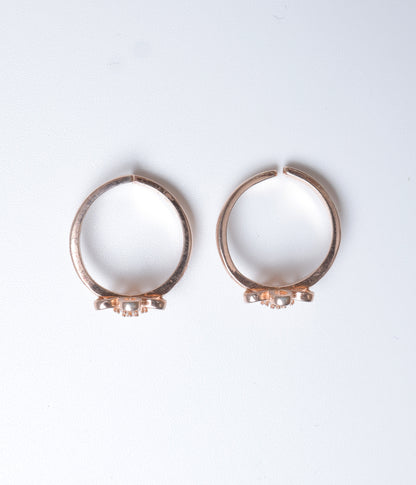 Rose gold floral toe ring in 92.5 sterling silver with sparkling CZ stones.