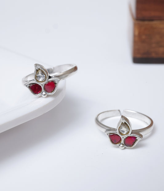 92.5 sterling silver toe ring with floral design, red stones and clear stone detailing.